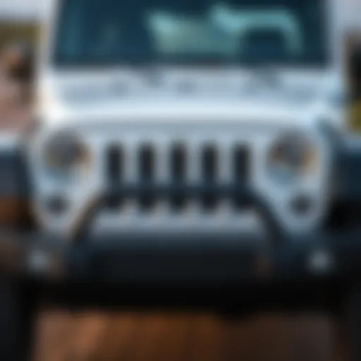 Front view of the 2012 White Jeep Wrangler Unlimited showcasing its distinctive grille and headlights