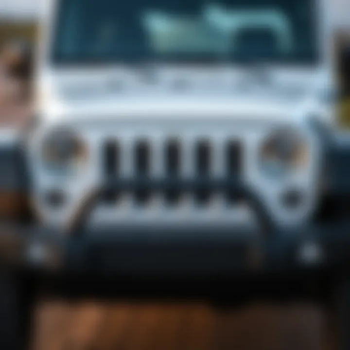 Front view of the 2012 White Jeep Wrangler Unlimited showcasing its distinctive grille and headlights