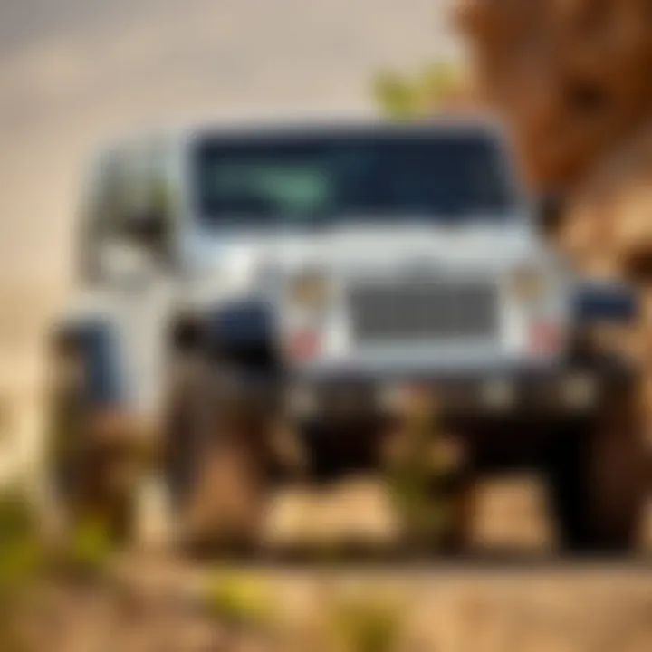 The 2012 White Jeep Wrangler Unlimited on a rugged off-road trail, emphasizing its capabilities
