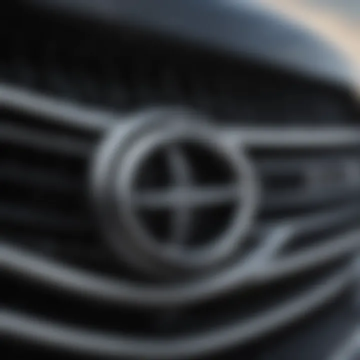 A close-up of the Lexus logo on the front grille, symbolizing quality and reliability