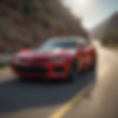 Chevrolet Camaro driving on a winding road with scenic background