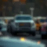 A variety of used trucks on a dealership lot in Saco, Maine