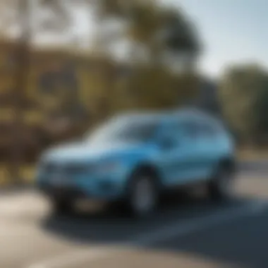 Dynamic driving shot of the light blue Volkswagen Tiguan on the road