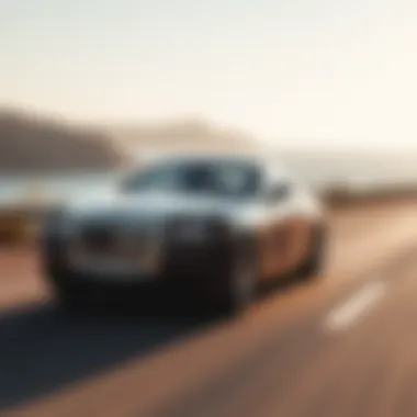 A scenic view of a Kerbeck Rolls Royce driving along a coastal road